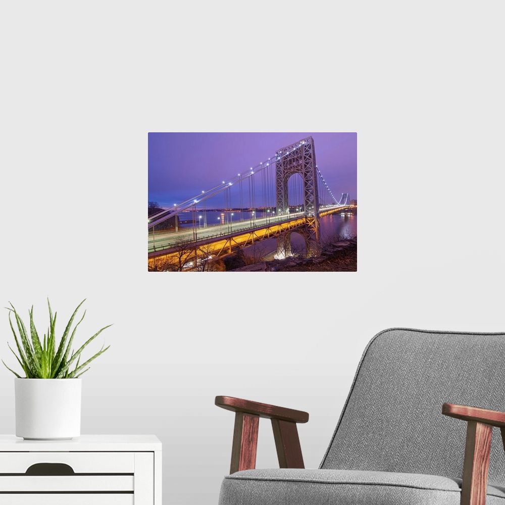 A modern room featuring George Washington Bridge at dawn in New York City.