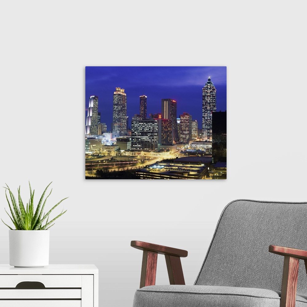A modern room featuring USA, Georgia, Atlanta, skyline, dusk