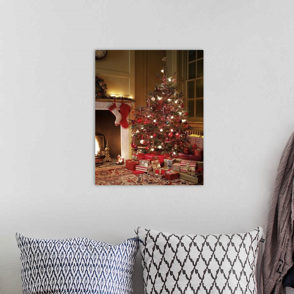 A bohemian room featuring Gifts in front of Christmas tree