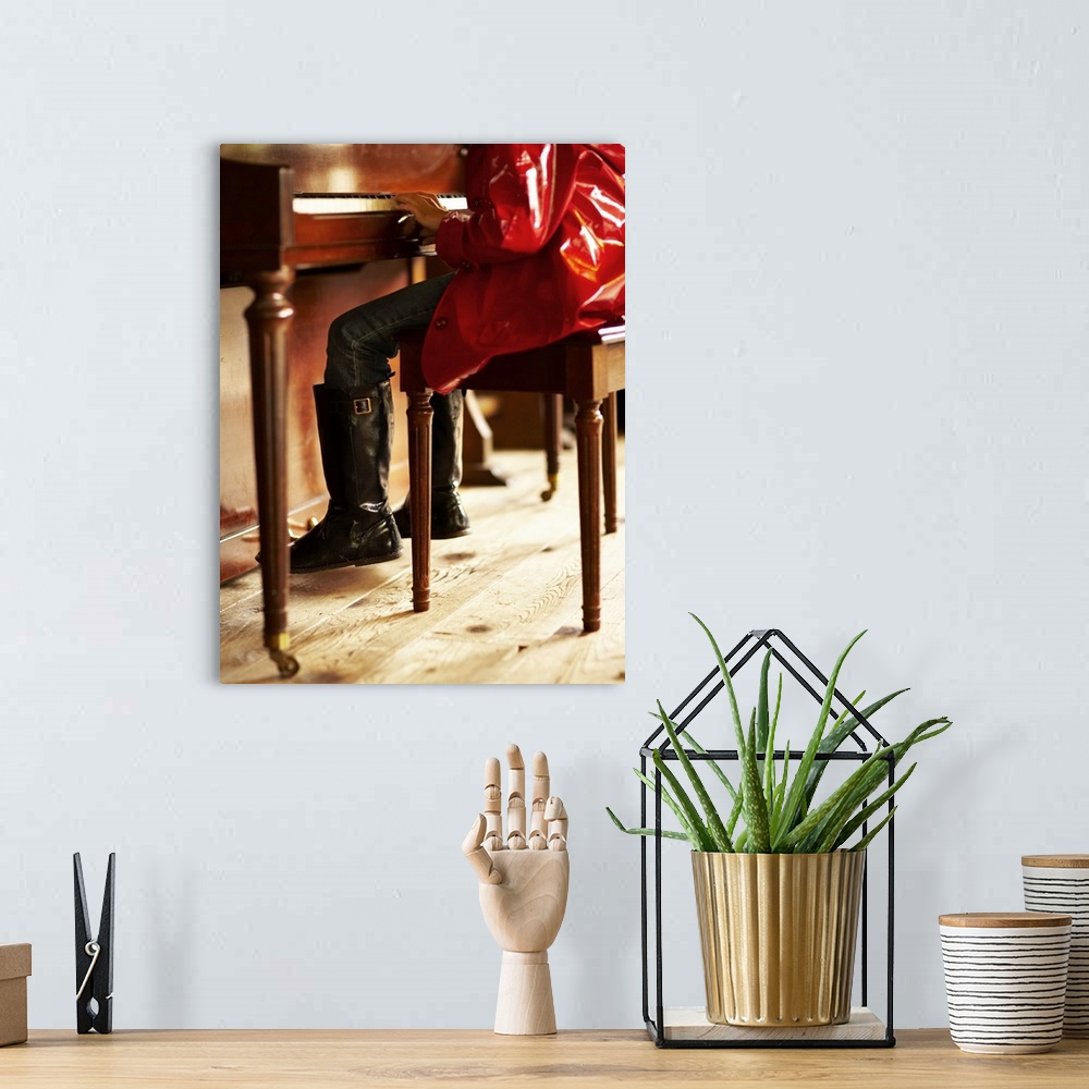 A bohemian room featuring Girl in red raincoat playing piano