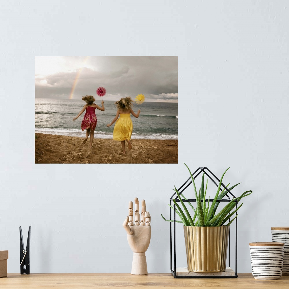 A bohemian room featuring Girls running on beach holding windmills
