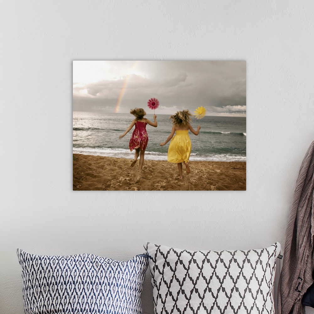 A bohemian room featuring Girls running on beach holding windmills