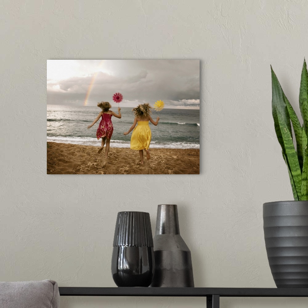 A modern room featuring Girls running on beach holding windmills