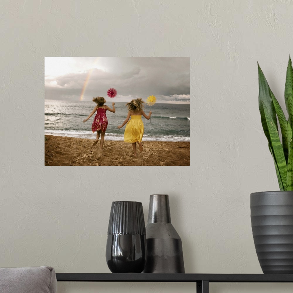 A modern room featuring Girls running on beach holding windmills