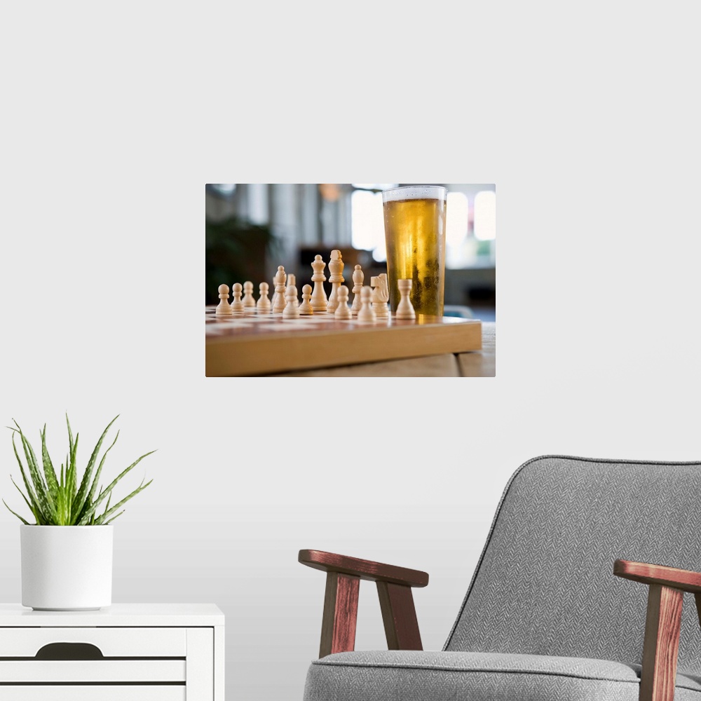 A modern room featuring Glass of beer on chess board