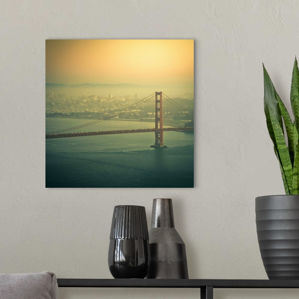 A modern room featuring Golden Gate bridge at sunset in San Francisco, US.