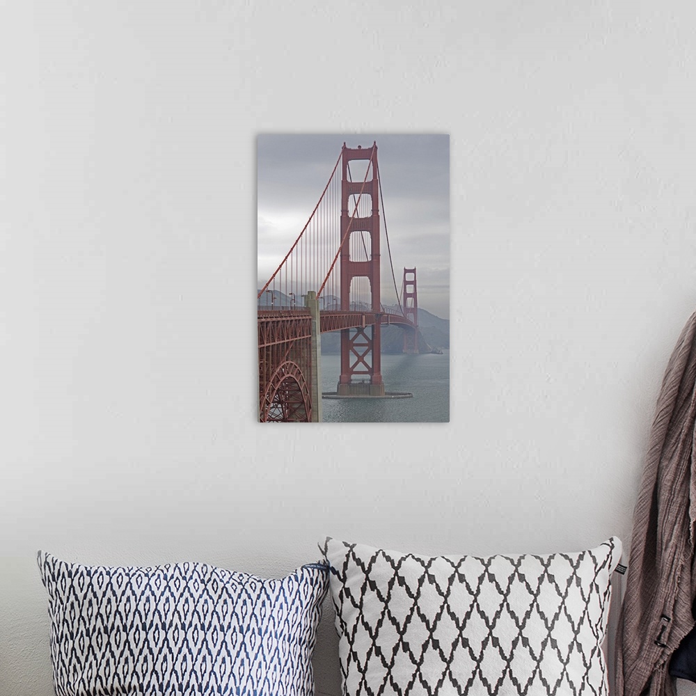 A bohemian room featuring Golden Gate Bridge in mist.