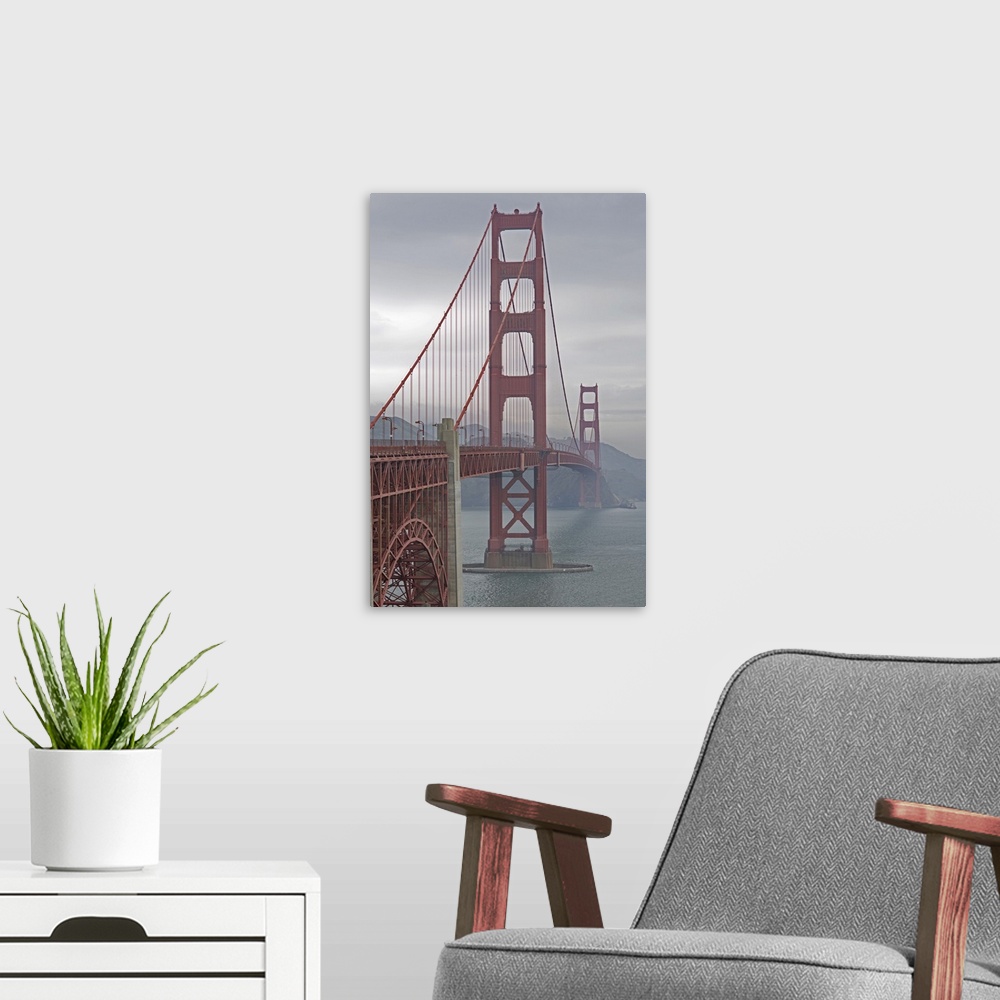 A modern room featuring Golden Gate Bridge in mist.