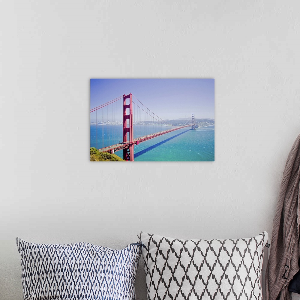 A bohemian room featuring A high angle photograph is taken of the Golden Gate bridge on a bright sunny day with a soft haze...