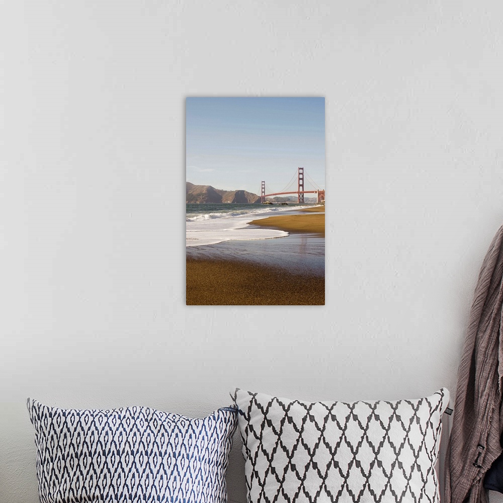 A bohemian room featuring Vertical photograph taken from a distance of the Golden Gate Bridge which a strip of beach and th...