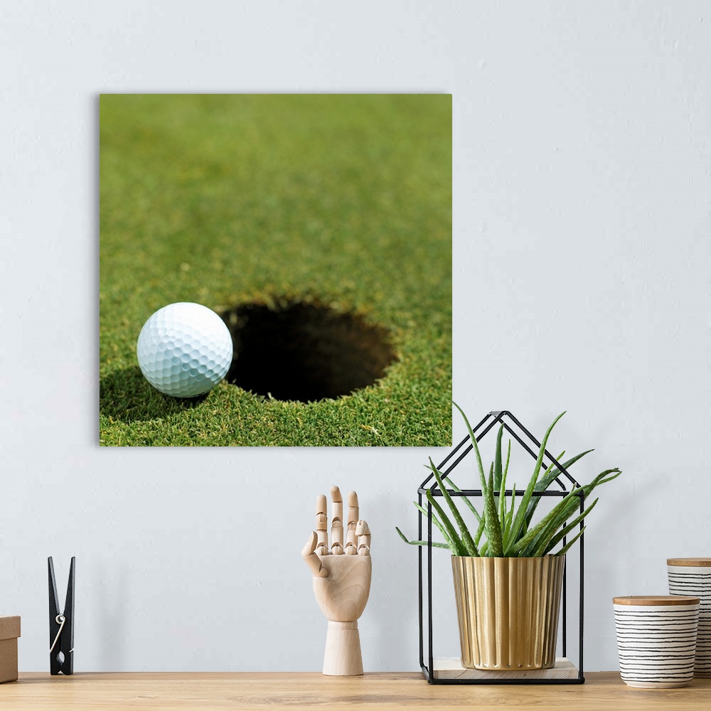 A bohemian room featuring Golf ball on the edge of the hole