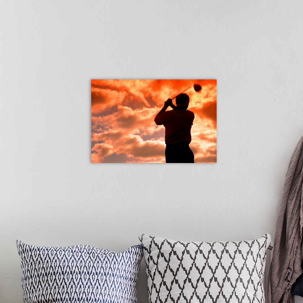 A bohemian room featuring golf player in the sunset