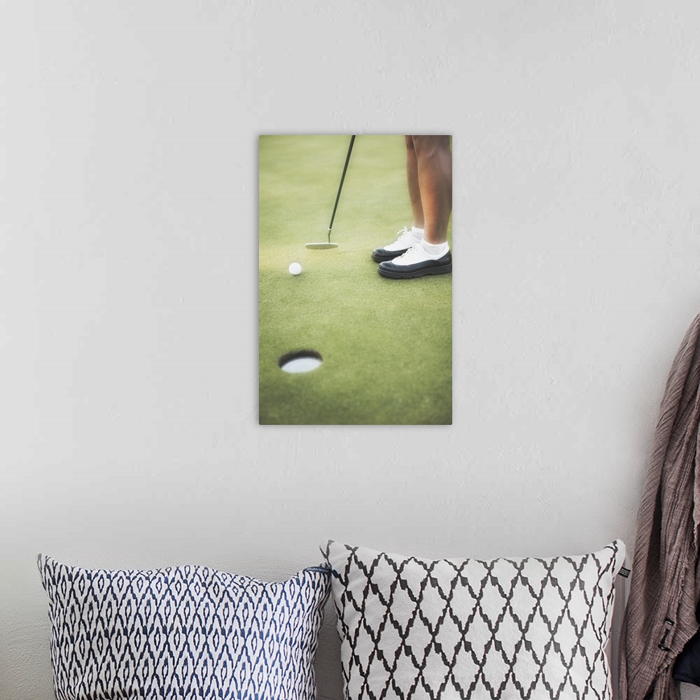A bohemian room featuring Golfer putting