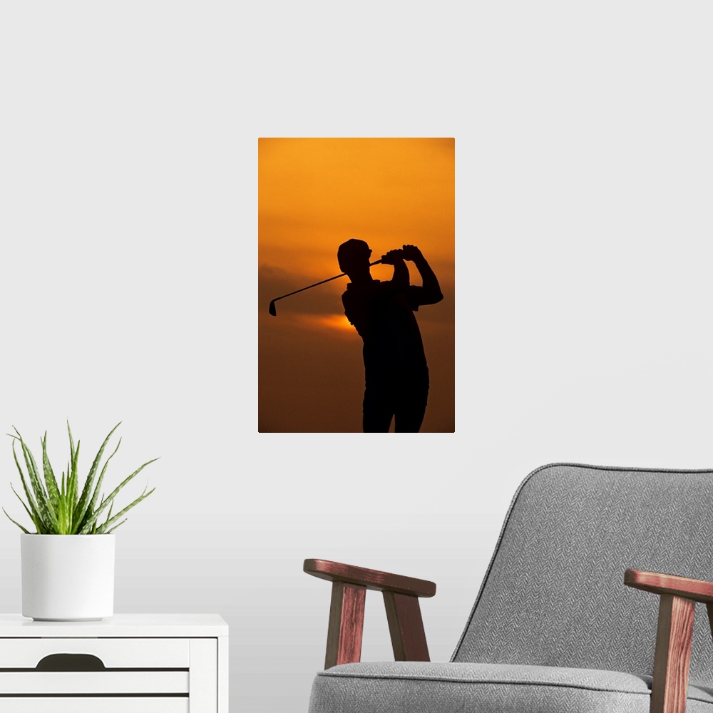 A modern room featuring Golfer silhouetted by sunset