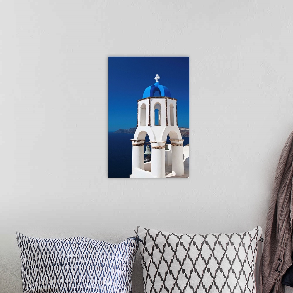 A bohemian room featuring Greece, Cyclades Islands, Santorini, Oia, Church bell tower at coast