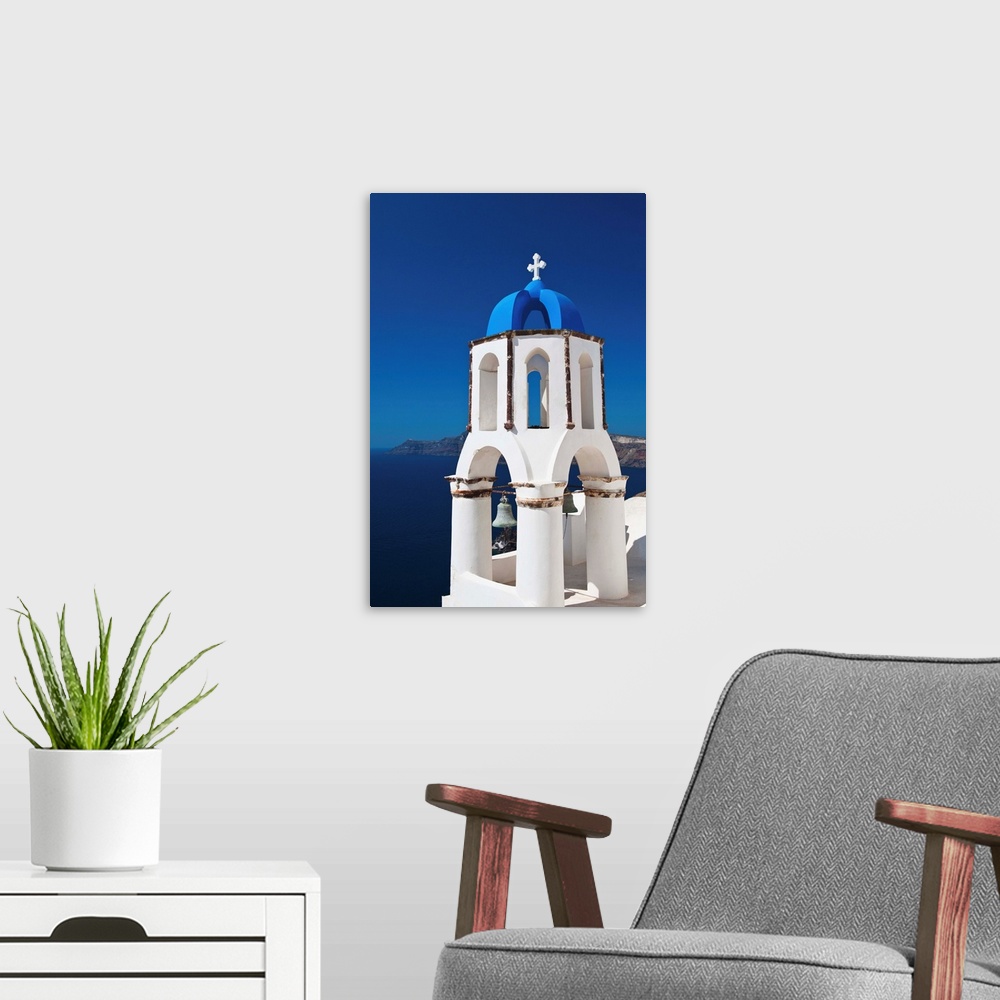 A modern room featuring Greece, Cyclades Islands, Santorini, Oia, Church bell tower at coast