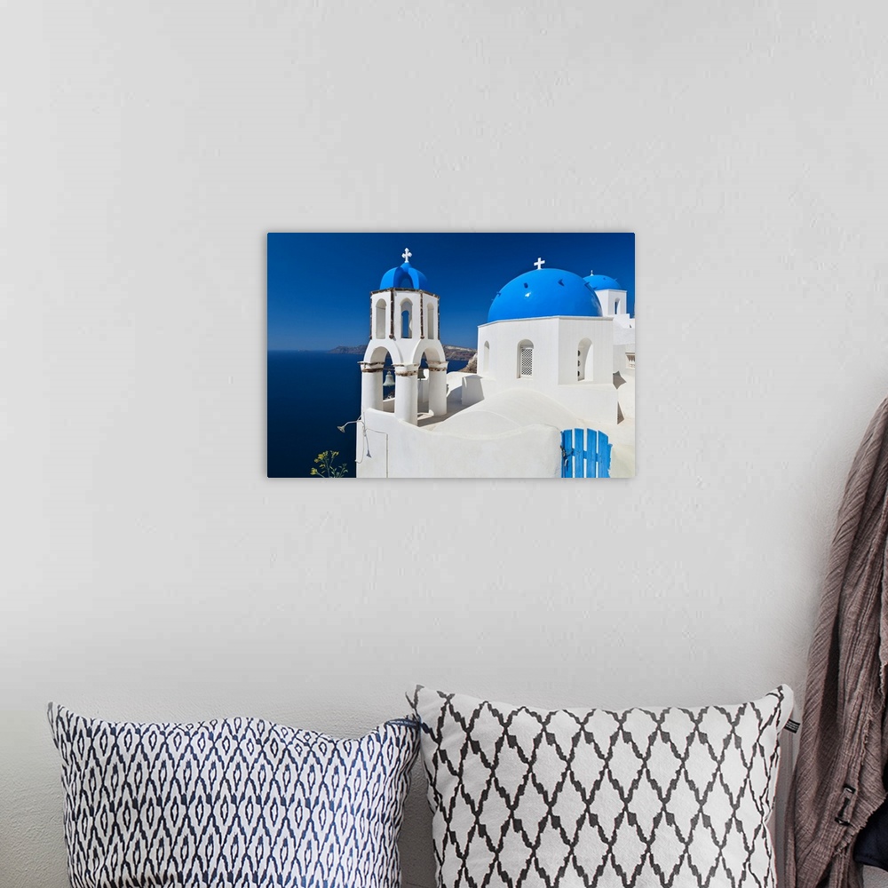 A bohemian room featuring Greece, Cyclades Islands, Santorini, Oia, Church with bell tower at coast