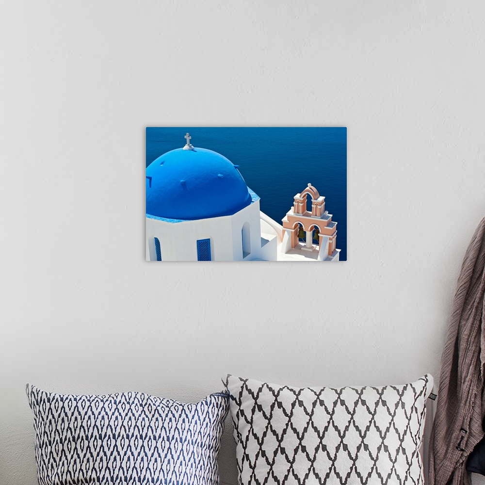 A bohemian room featuring Greece, Cyclades Islands, Santorini, Oia, Church with bell tower by sea