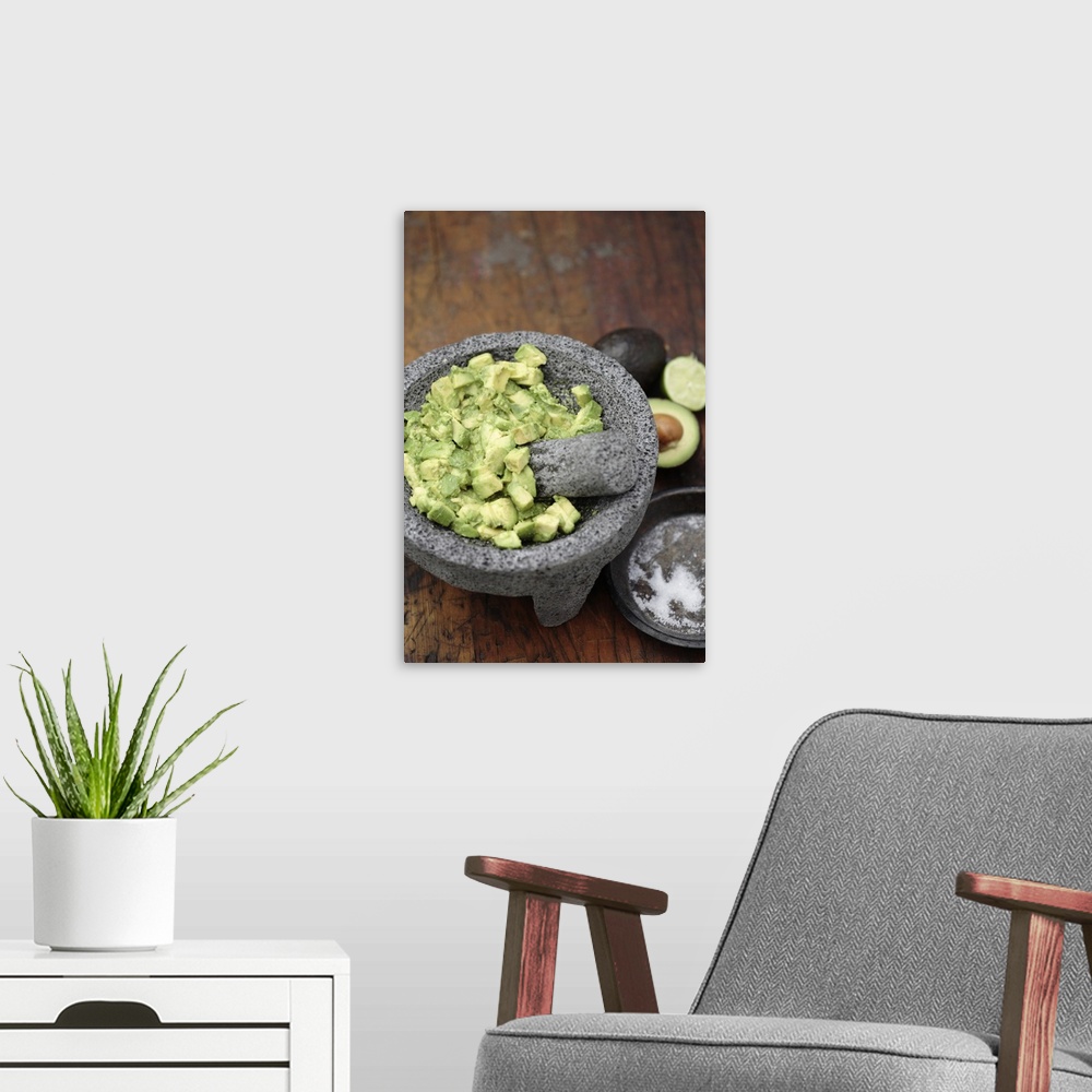 A modern room featuring Guacamole in mortar with pestle