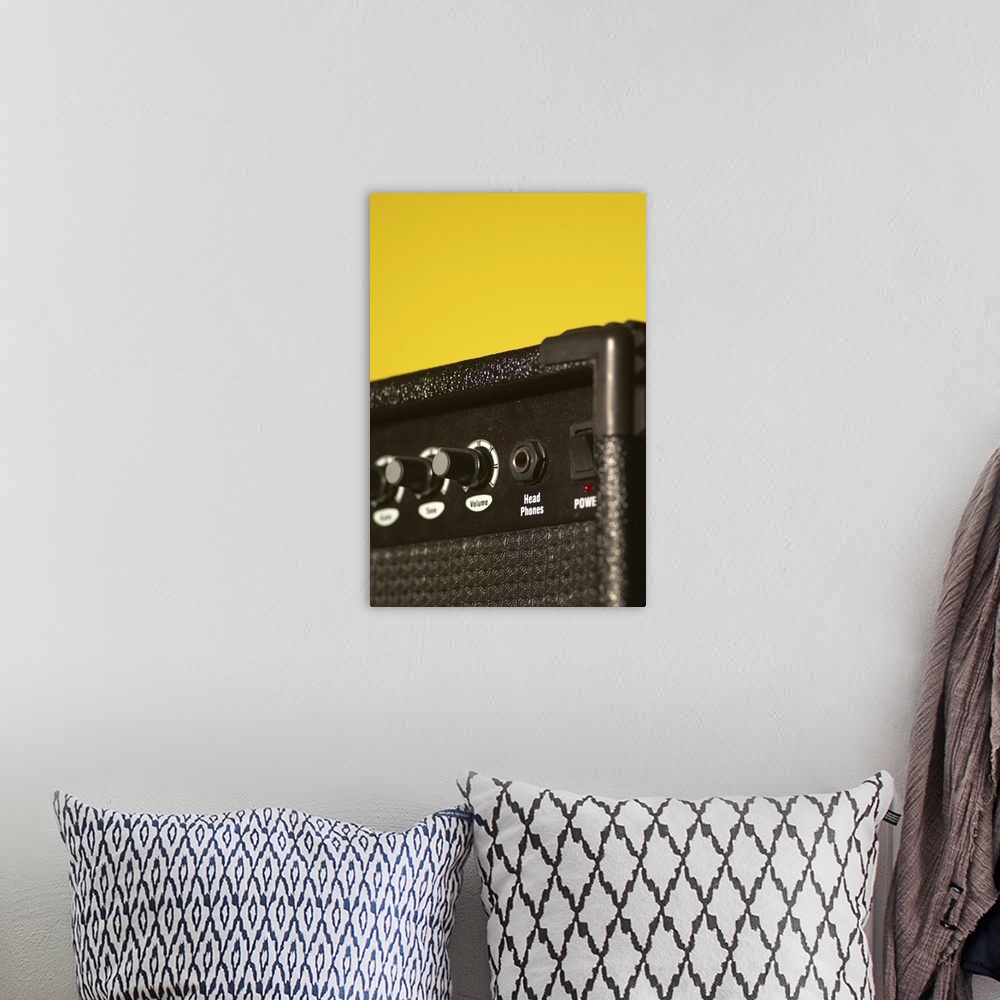 A bohemian room featuring Guitar amplifier on yellow background
