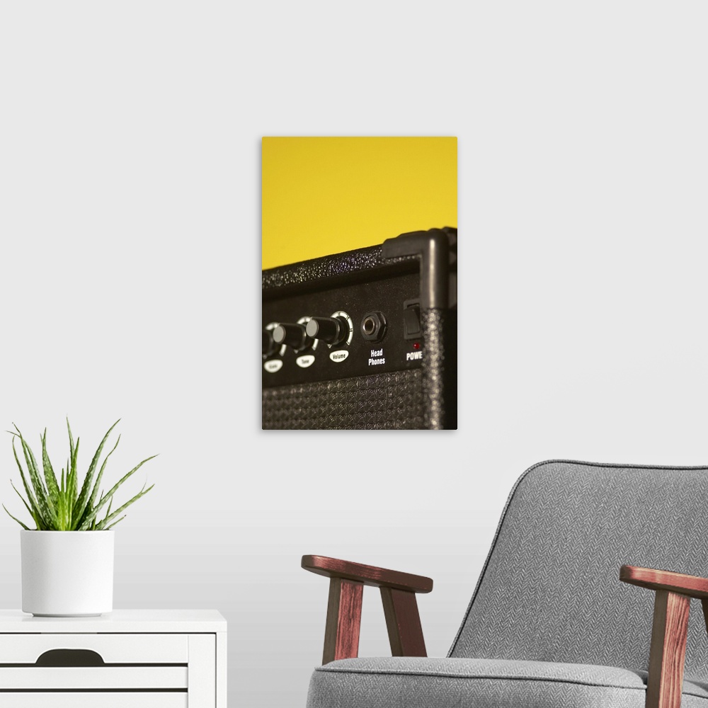 A modern room featuring Guitar amplifier on yellow background