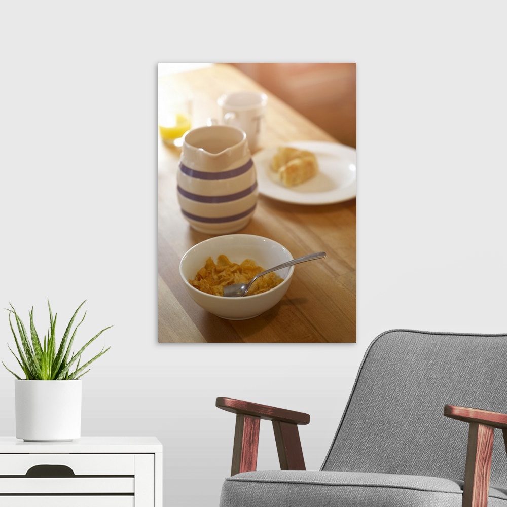 A modern room featuring Half eaten breakfast on kitchen table.