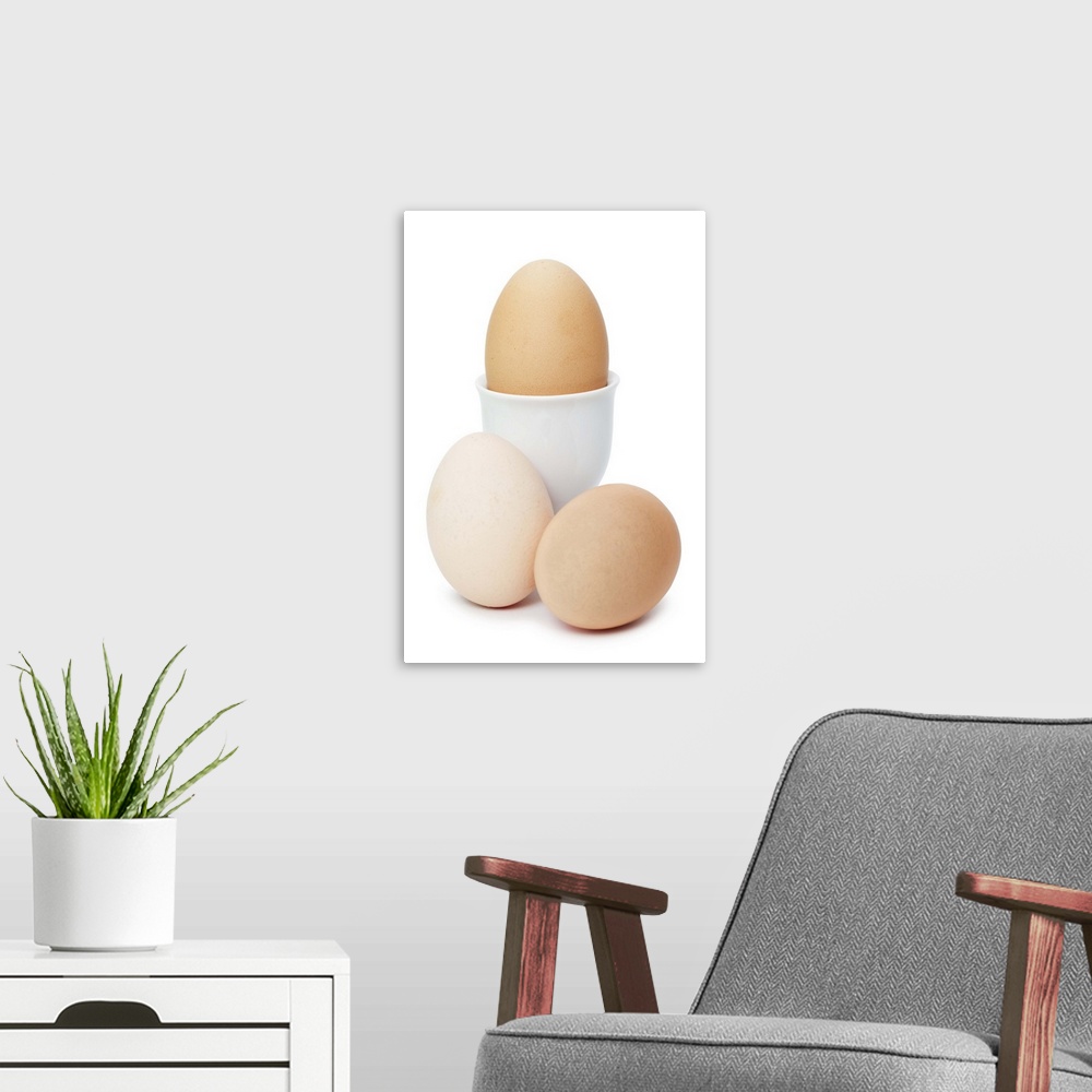 A modern room featuring Three eggs isolated on a white background