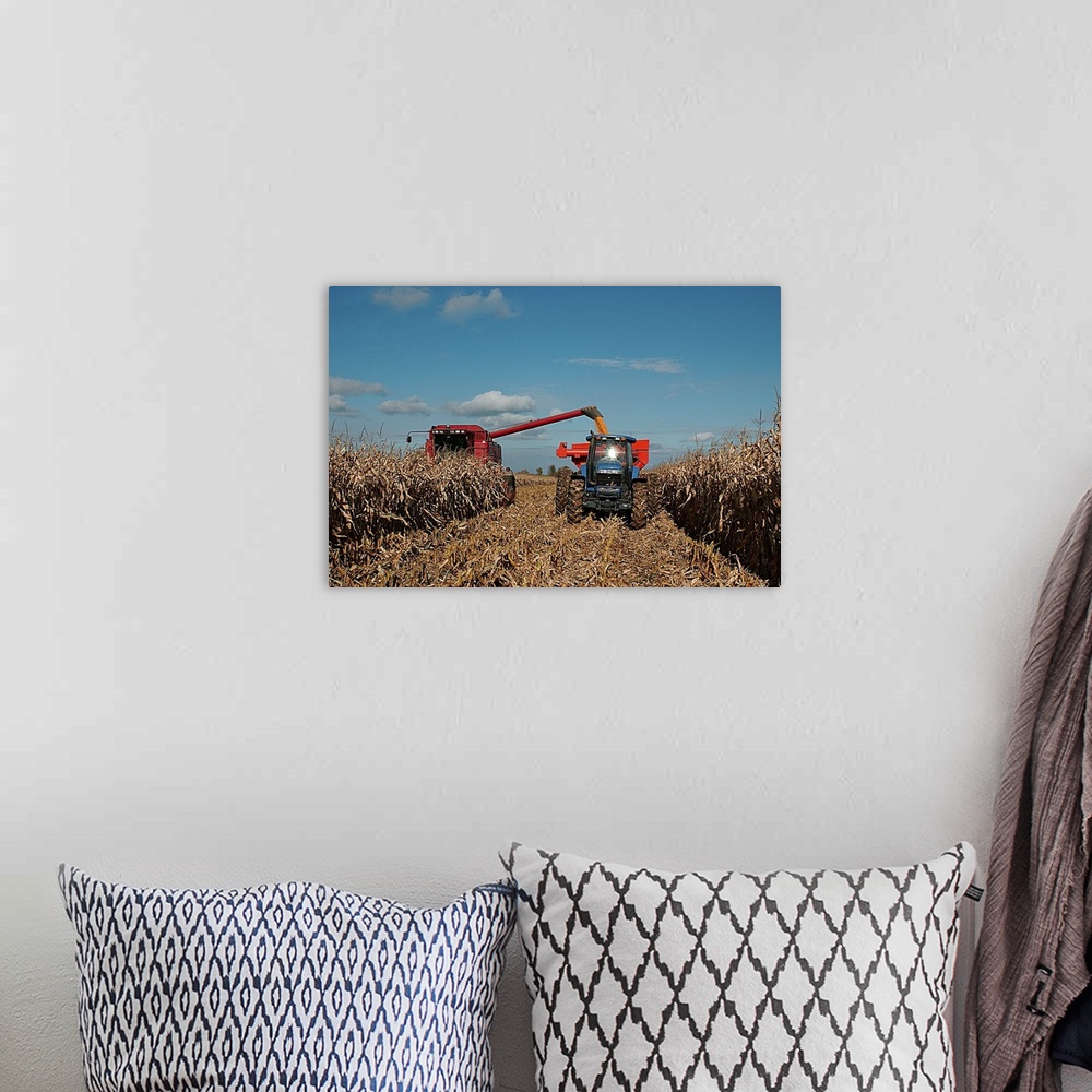 A bohemian room featuring Harvest of crop with combine and tractor