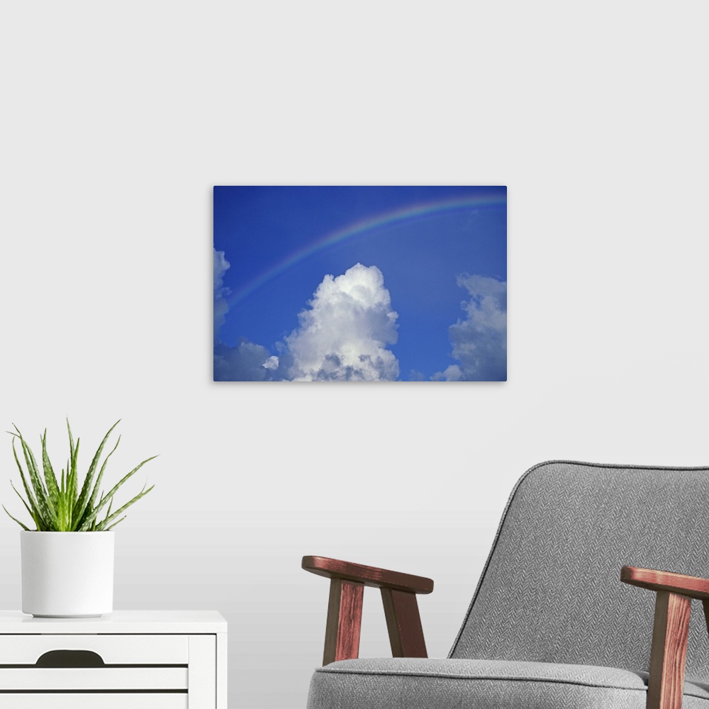 A modern room featuring Hawaii, Rainbow arching over clouds in blue sky
