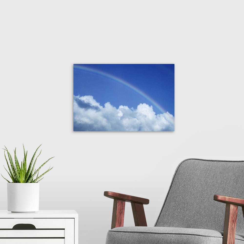 A modern room featuring Hawaii, Rainbow arching over clouds in blue sky