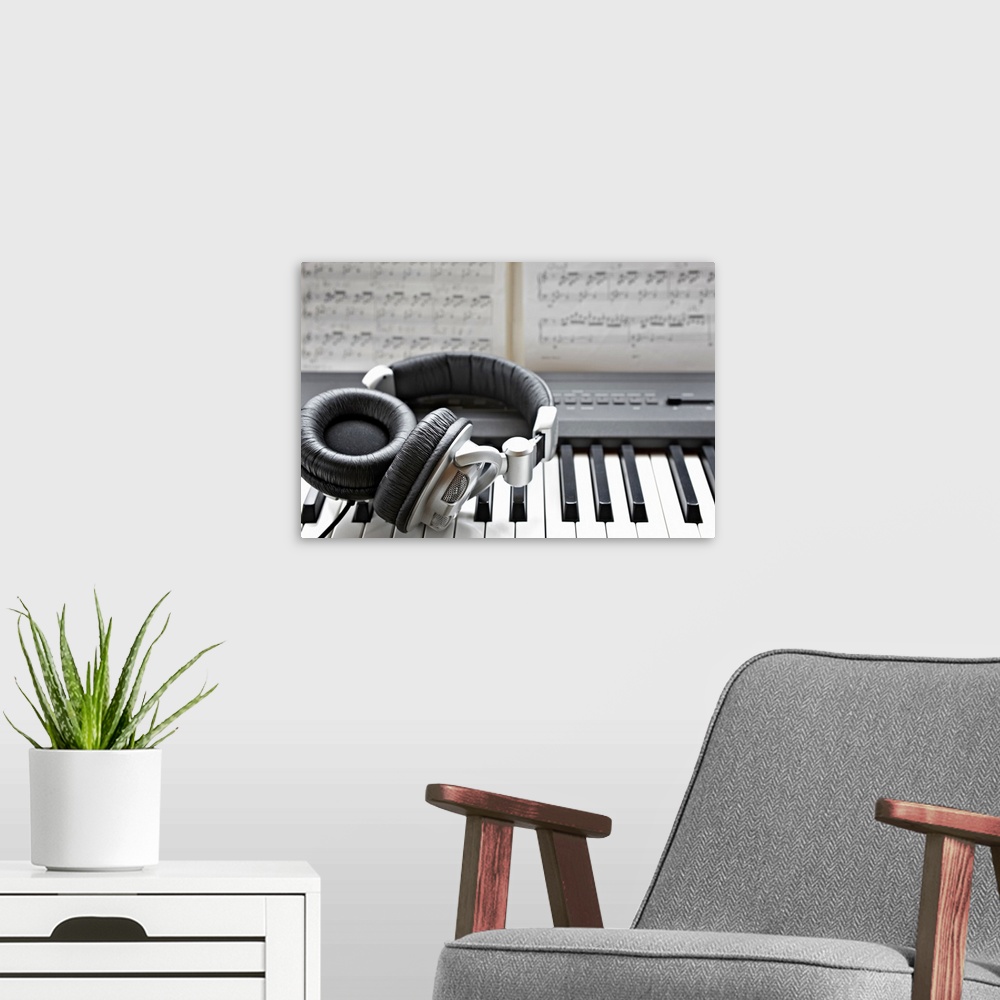 A modern room featuring Headphones on electronic piano keyboard