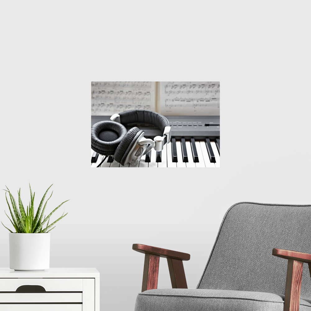A modern room featuring Headphones on electronic piano keyboard
