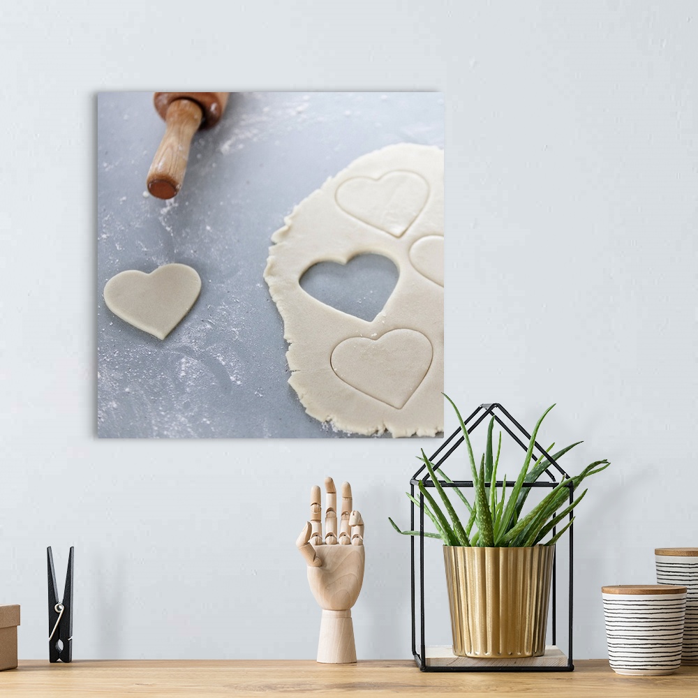 A bohemian room featuring Heart shape cut out of a sheet of rolled out cookie dough