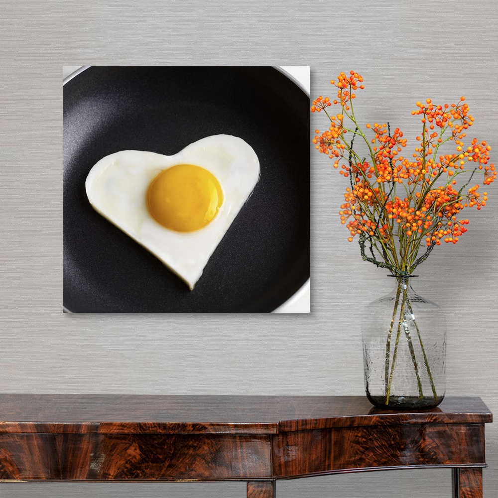A traditional room featuring Heart-shaped fried egg in skillet