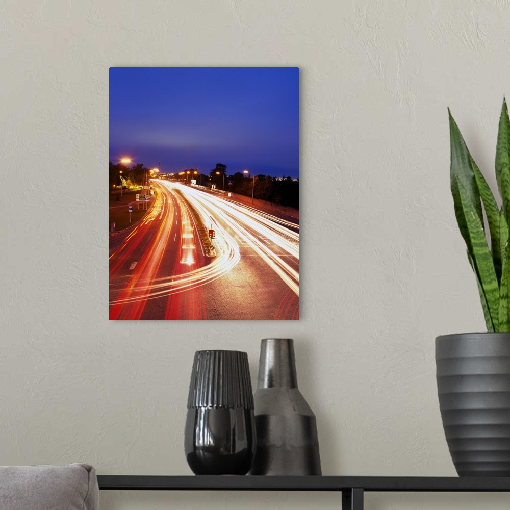 A modern room featuring high angle time lapse view of traffic movement on a highway