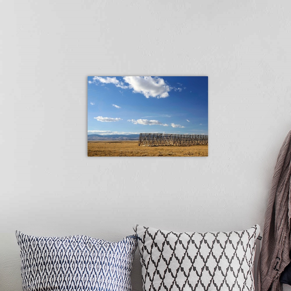 A bohemian room featuring The high plains desert with guard against snow drifts outside of Laramie, Wyoming.