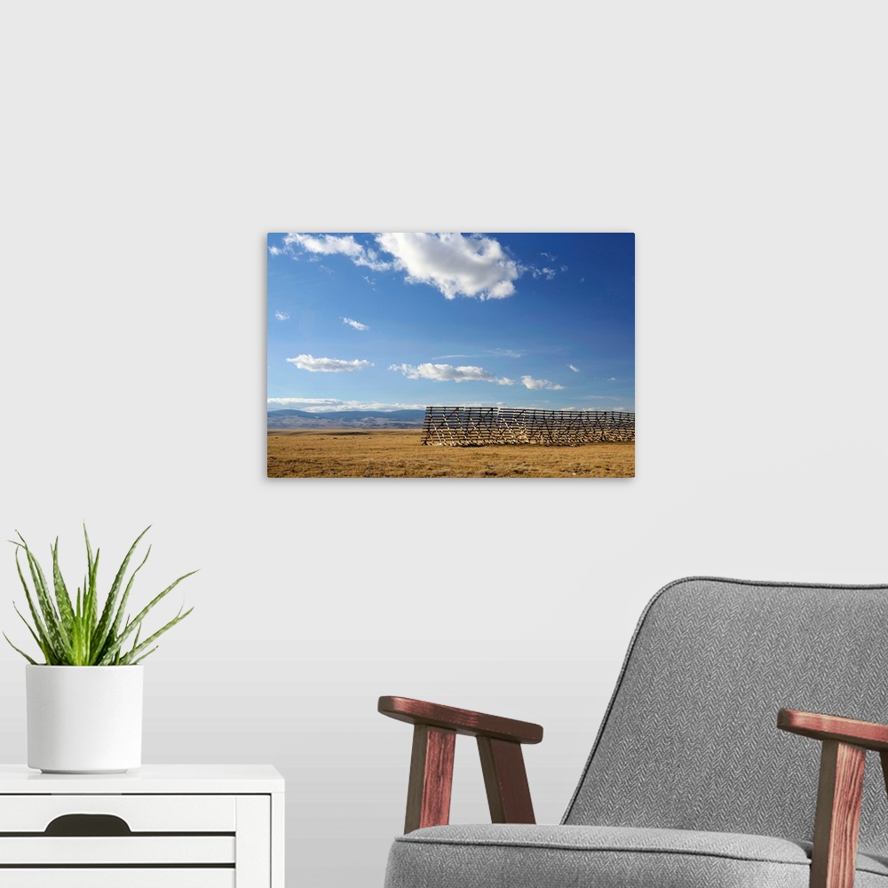 A modern room featuring The high plains desert with guard against snow drifts outside of Laramie, Wyoming.