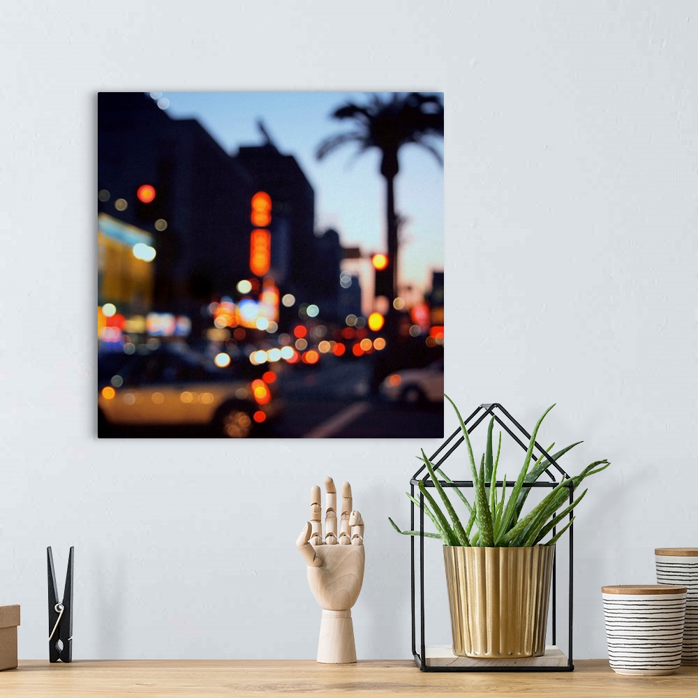 A bohemian room featuring Out of focus image of Hollywood Boulevard at sunset. Bokeh lights, flash cars and palm trees