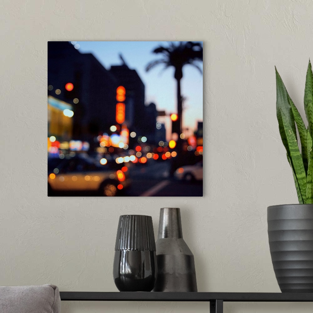 A modern room featuring Out of focus image of Hollywood Boulevard at sunset. Bokeh lights, flash cars and palm trees