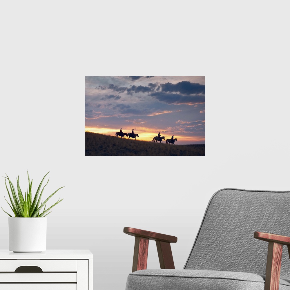 A modern room featuring Horseback Riders At Sunset