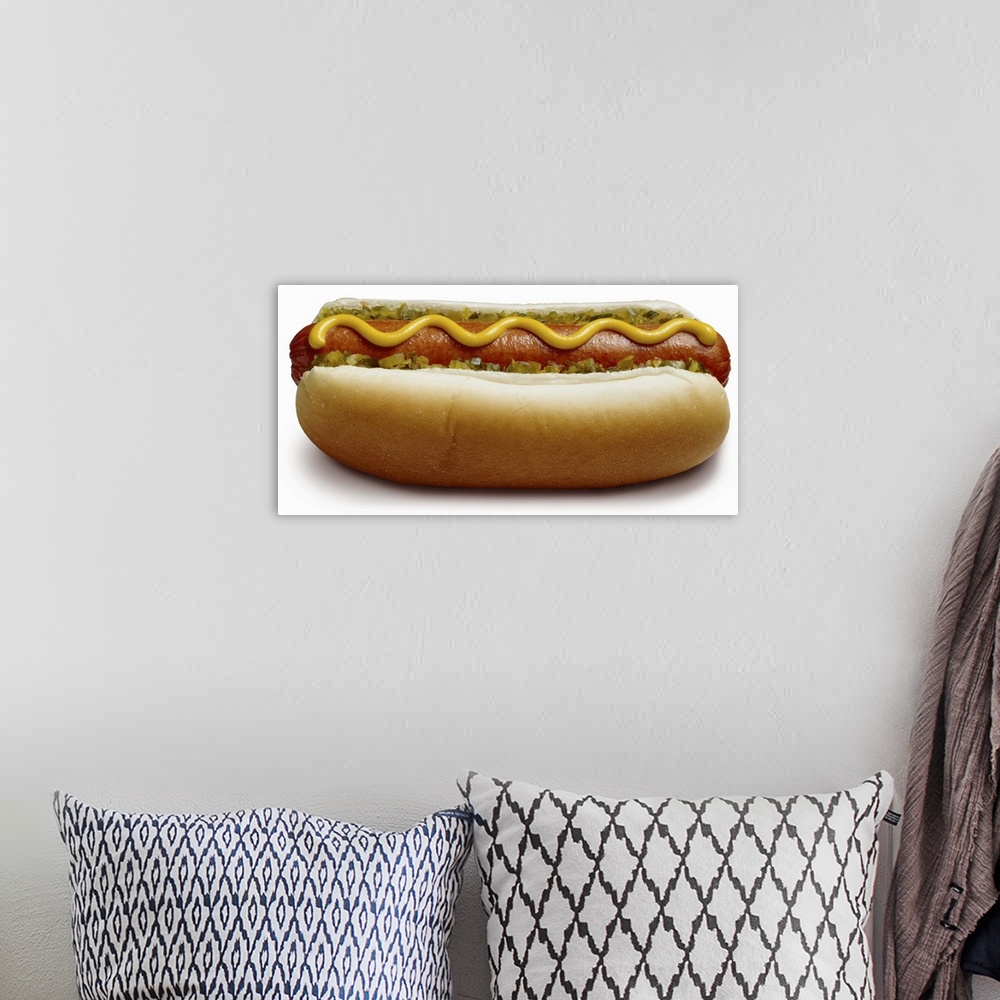 A bohemian room featuring Hot dog with mustard and relish, close-up