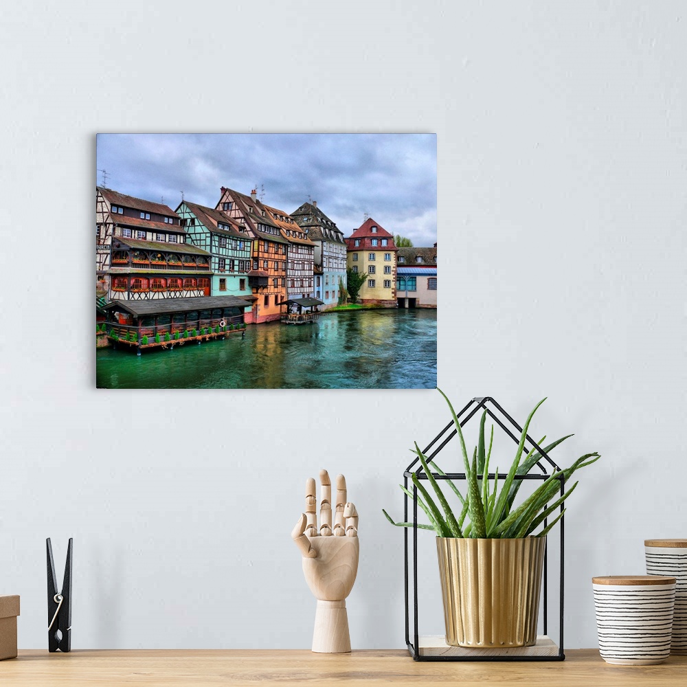 A bohemian room featuring Half-timbered houses of the Petite-France district of Strasbourg, overlooking the river Ill.