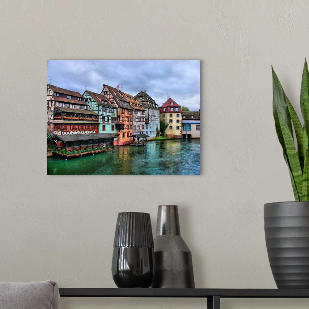 A modern room featuring Half-timbered houses of the Petite-France district of Strasbourg, overlooking the river Ill.