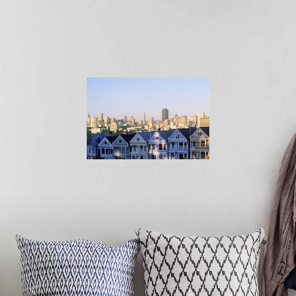 A bohemian room featuring Houses with skyline cityscape behind it, Alamo Square, San Francisco