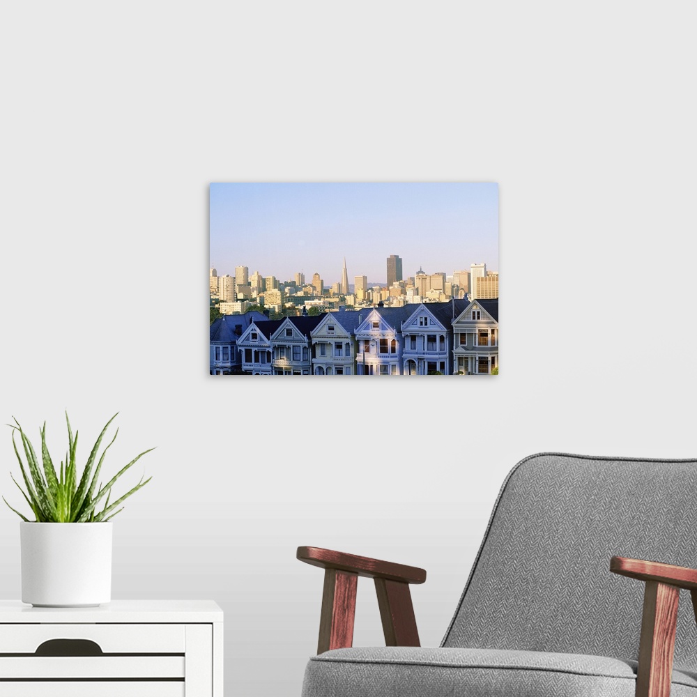 A modern room featuring Houses with skyline cityscape behind it, Alamo Square, San Francisco