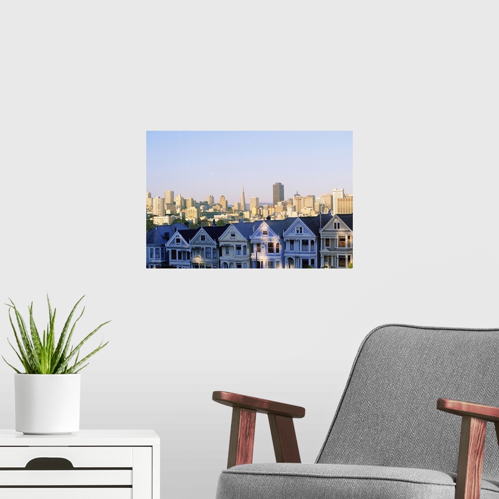 A modern room featuring Houses with skyline cityscape behind it, Alamo Square, San Francisco