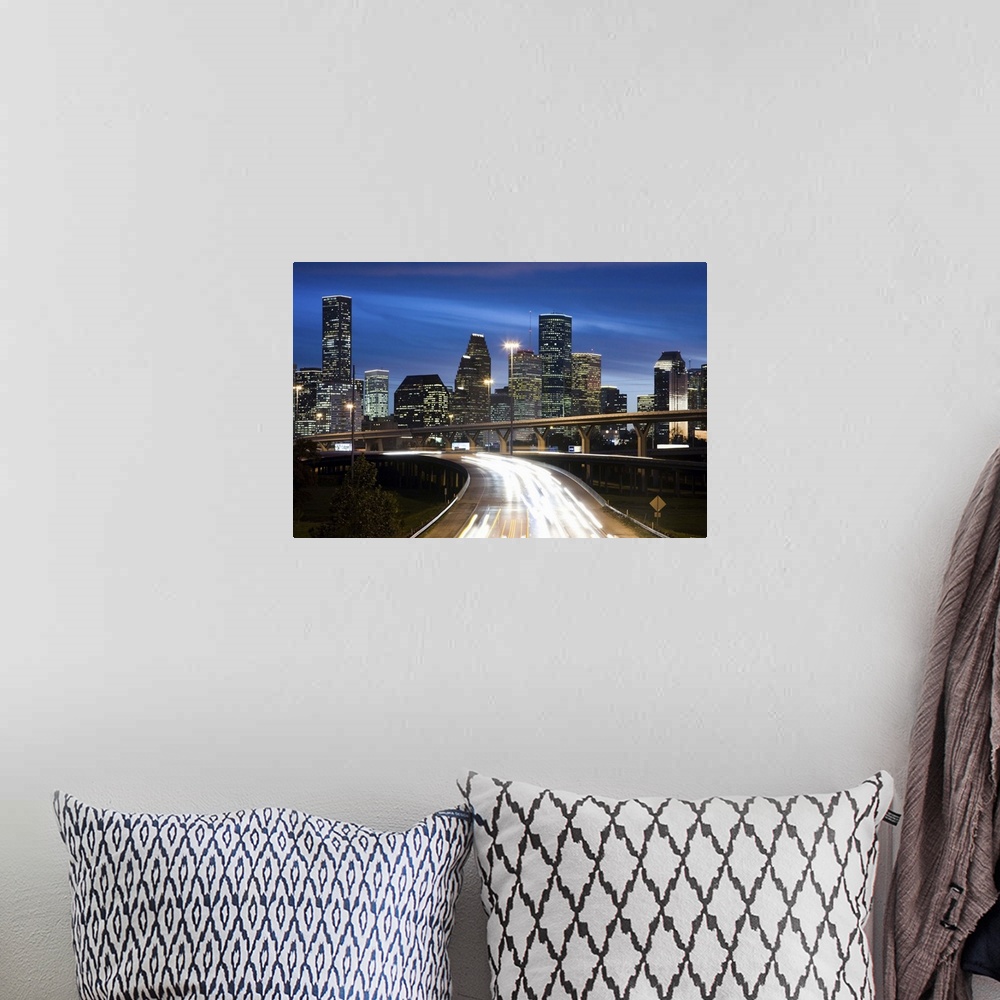 A bohemian room featuring Houston skyline at dusk with freeway in foreground
