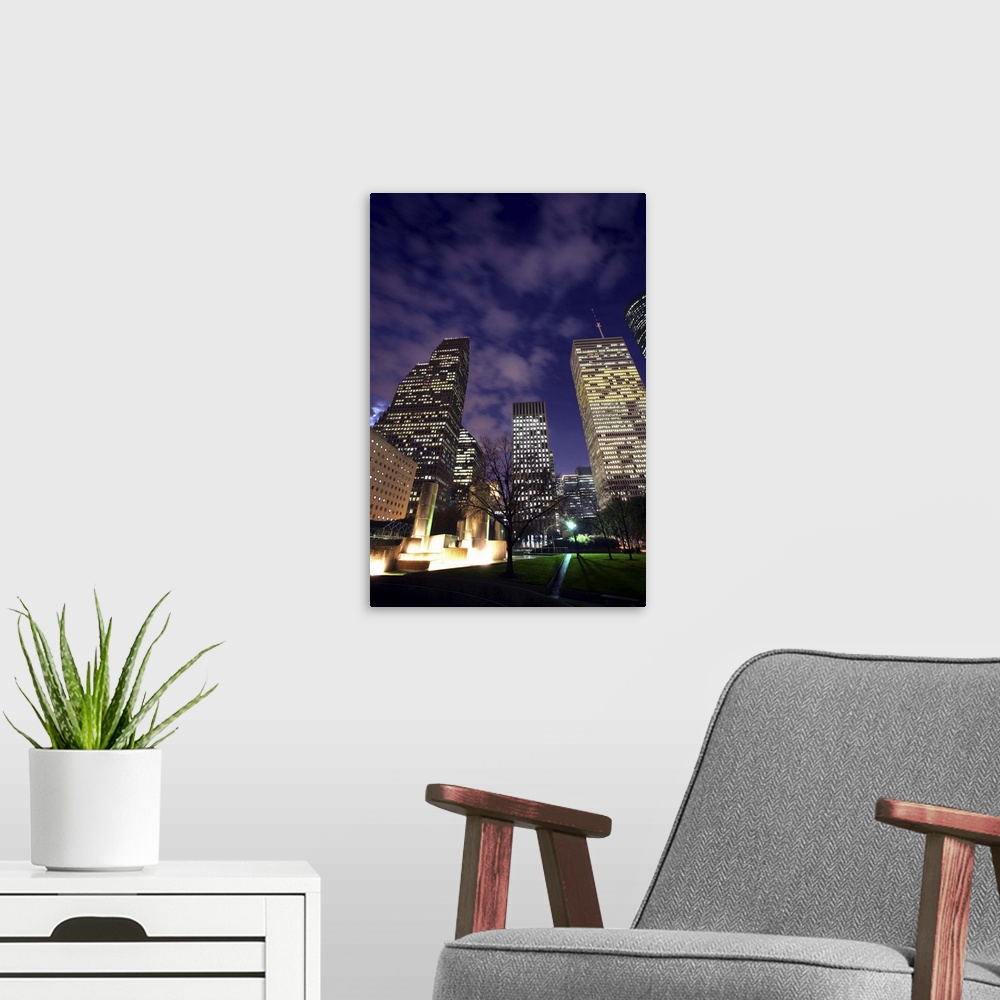 A modern room featuring Houston skyline at night