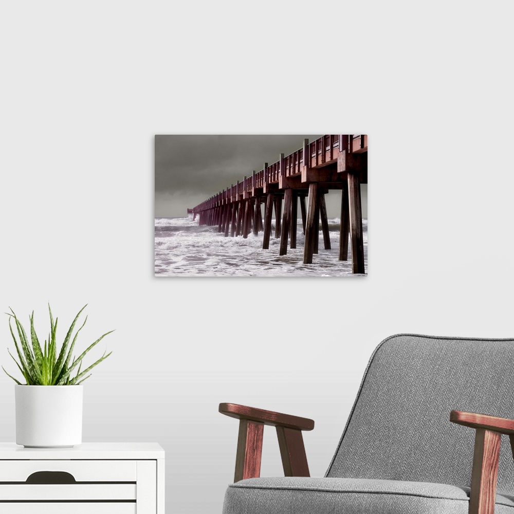 A modern room featuring Hurricane in the Gulf of Mexico sends waves crashing into the Pier at Pensacola Beach in Florida'...