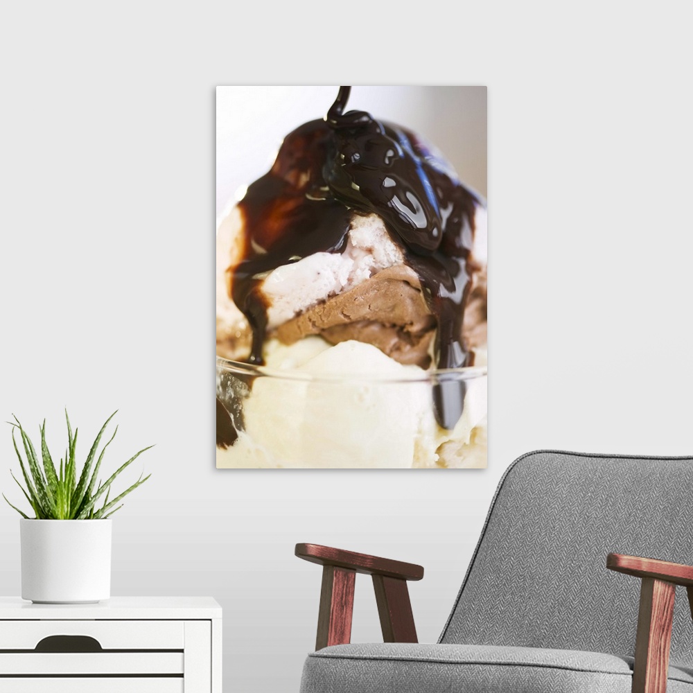A modern room featuring Ice cream sundae with chocolate syrup